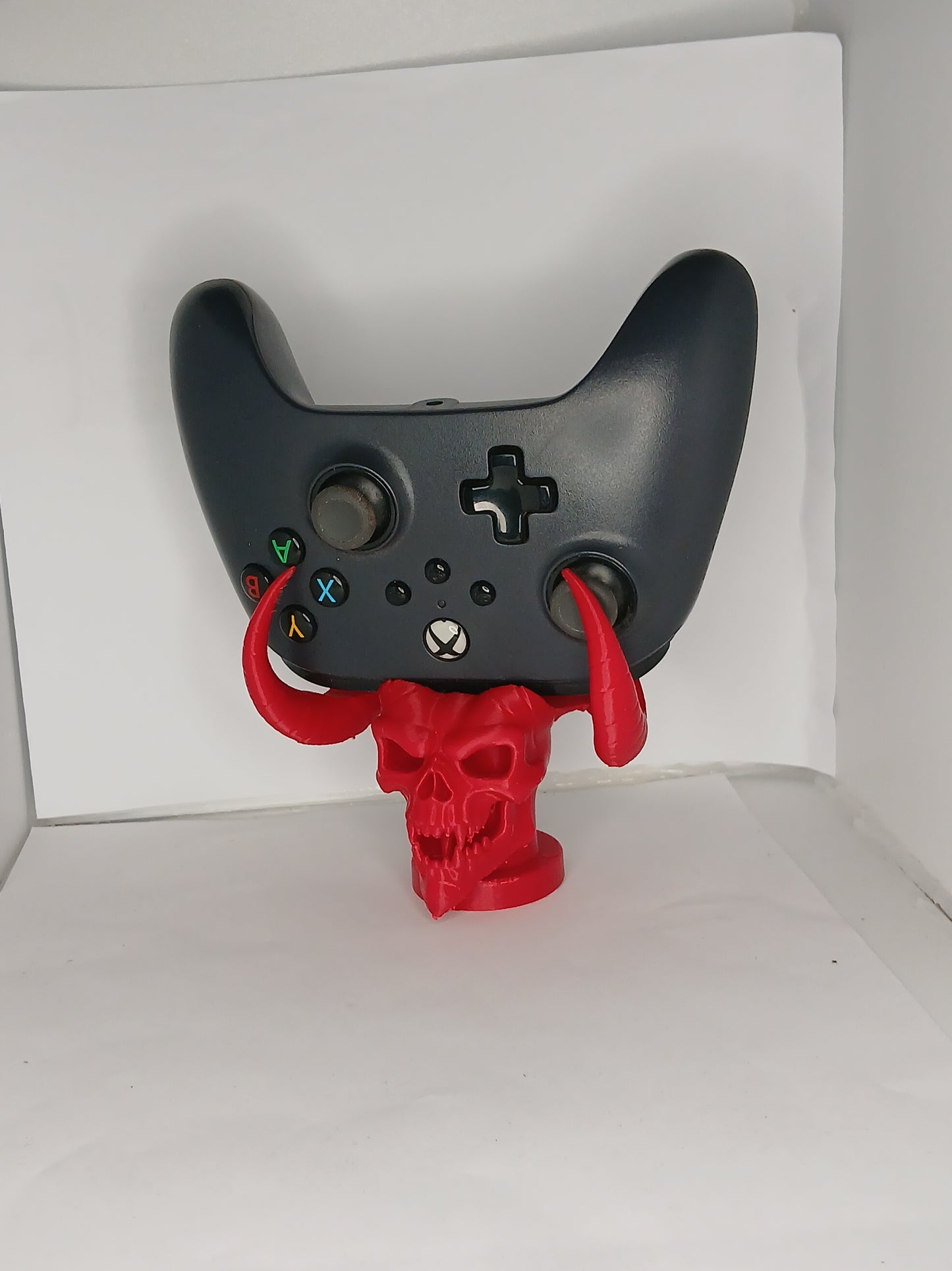 Horned demon skull controller stand